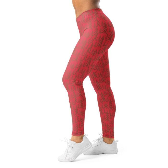 Raudonos temprės su eglučių raštu sportui ir žiemos veikloms. Minimalistinis eglučių raštas kuria modernų šventinį įvaizdį.